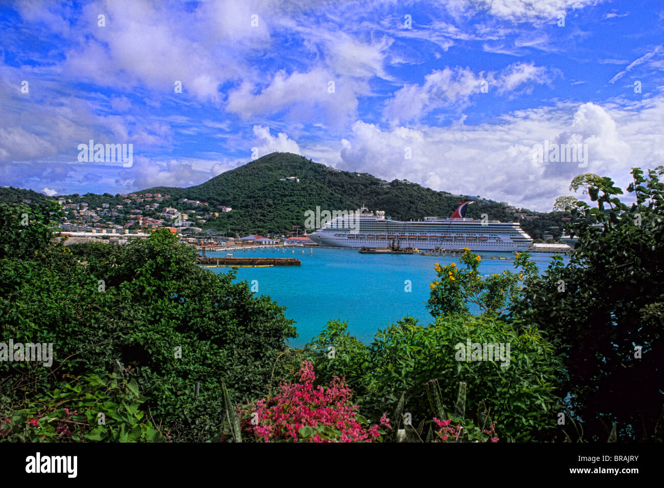 St Thomas in capital of Charlotte Amalie view from mountain showing ocean bay and Carnival Cruise Liberty at port Stock Photo