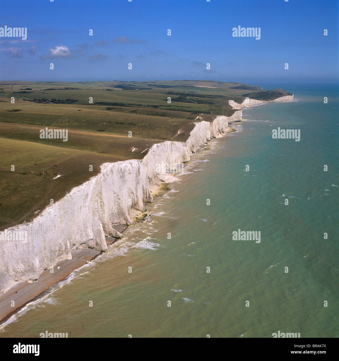 Aerial image of the chalk cliffs of the Seven Sisters, with Belle Tout lighthouse and Beachy Head in the distance, East Sussex Stock Photo