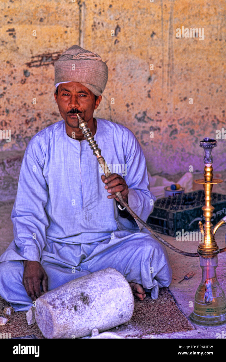 Man smoking water pipe in Cairo Egypt Stock Photo