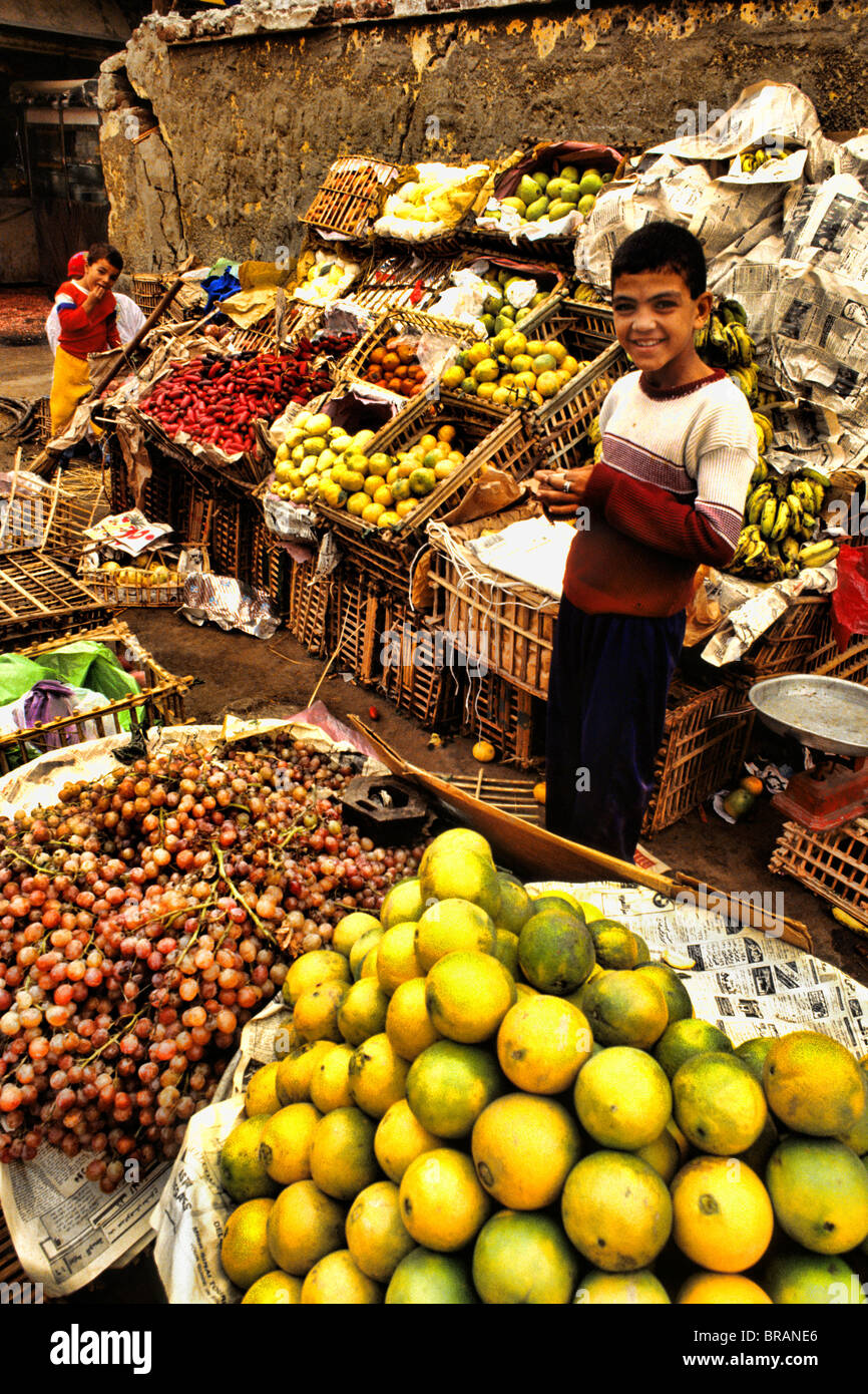 Vendor boy selling fruits and vegetables in market in Cairo Egypt Stock