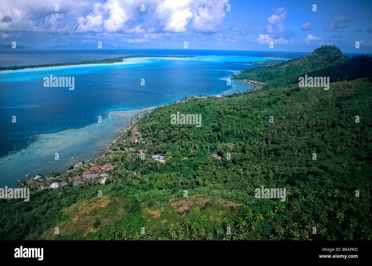 Aerial of the green water and clear blue colors of the islands of Bora
