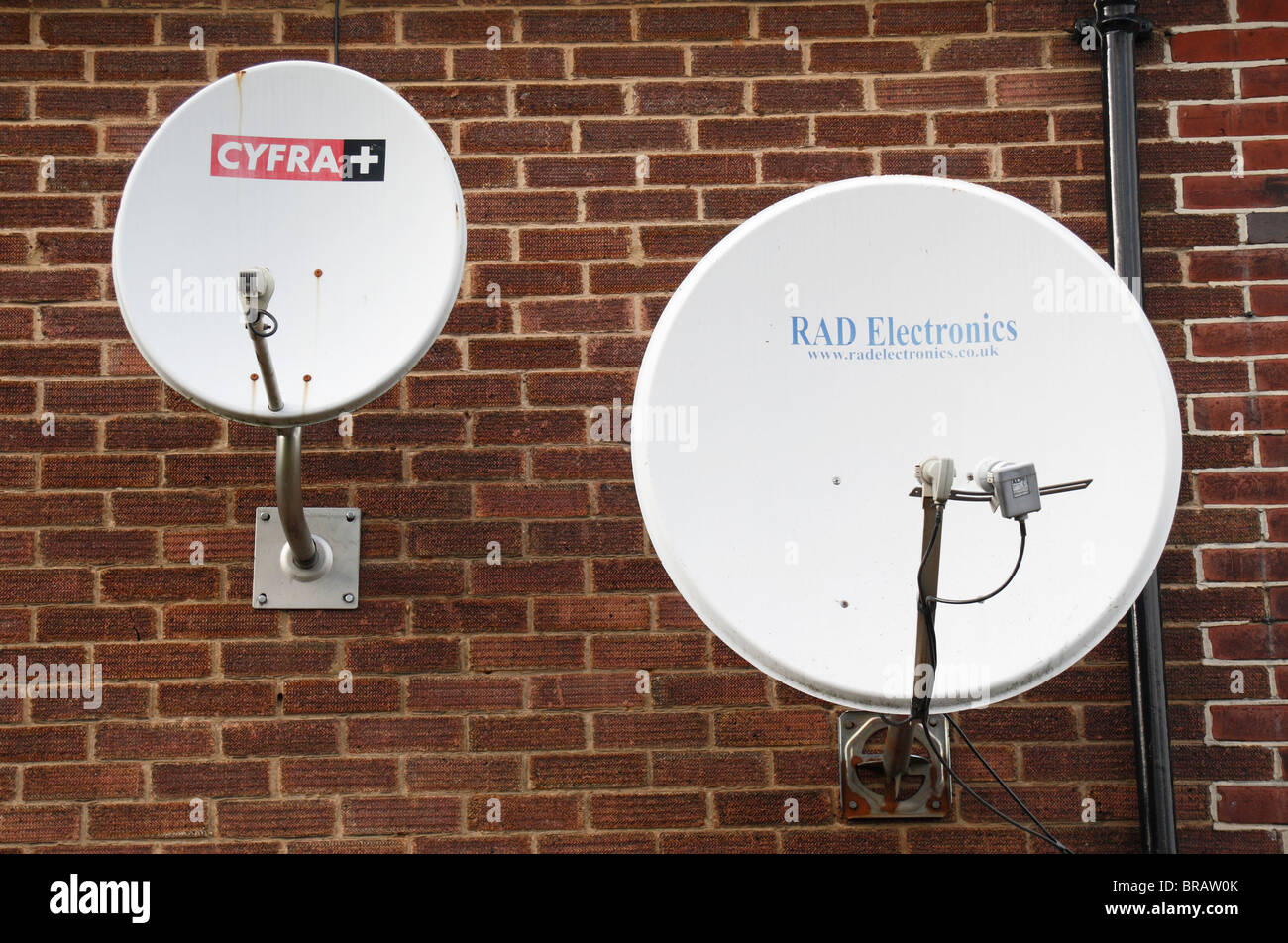 Two different sized satellite dishes on a house in Ealing, West London