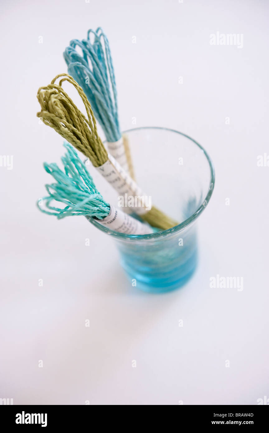 Paper string in a glass Stock Photo - Alamy