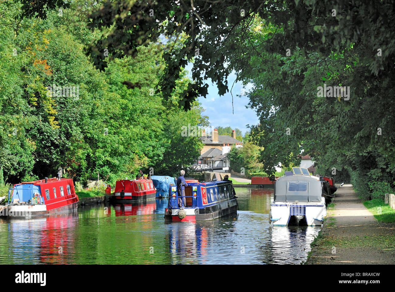 Grand Union Canal at Cowley,Uxbridge with narrow boat approaching lock,England UK Stock Photo