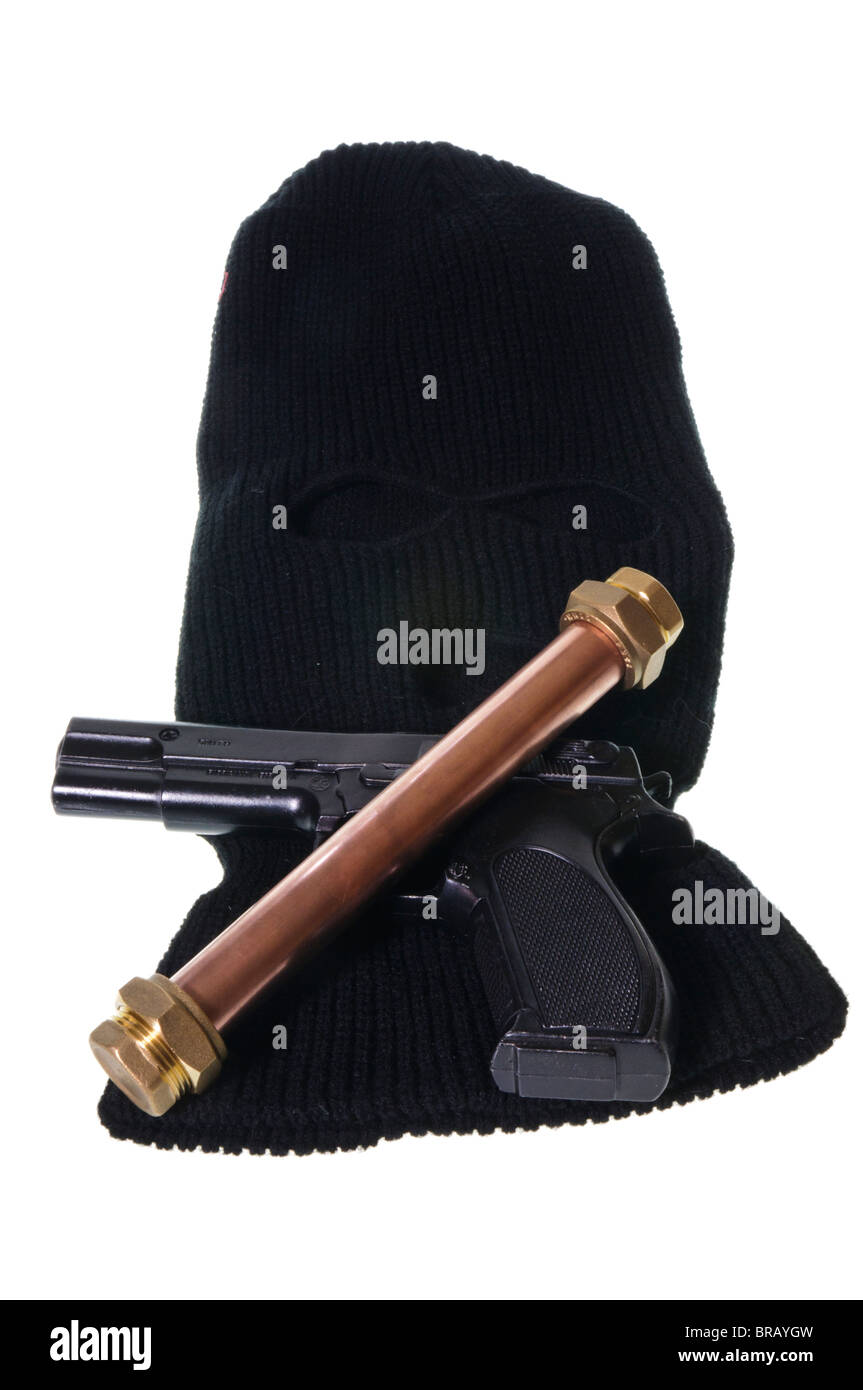 Pipebomb, handgun and balaclava Stock Photo