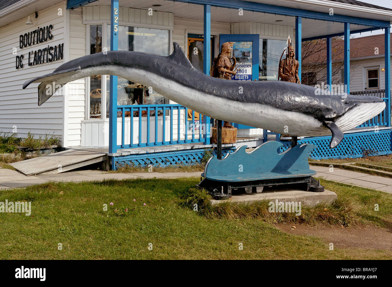 A wooden sculpture of a blue whale in Tadoussac in Quebec Stock Photo ...