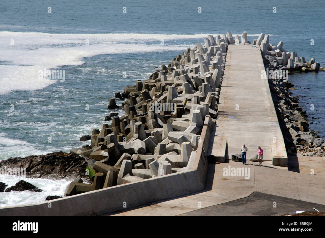 Dolosse protect the harbour wall at Yzerfontein a popular seaside resort on the west coast of South Africa Stock Photo