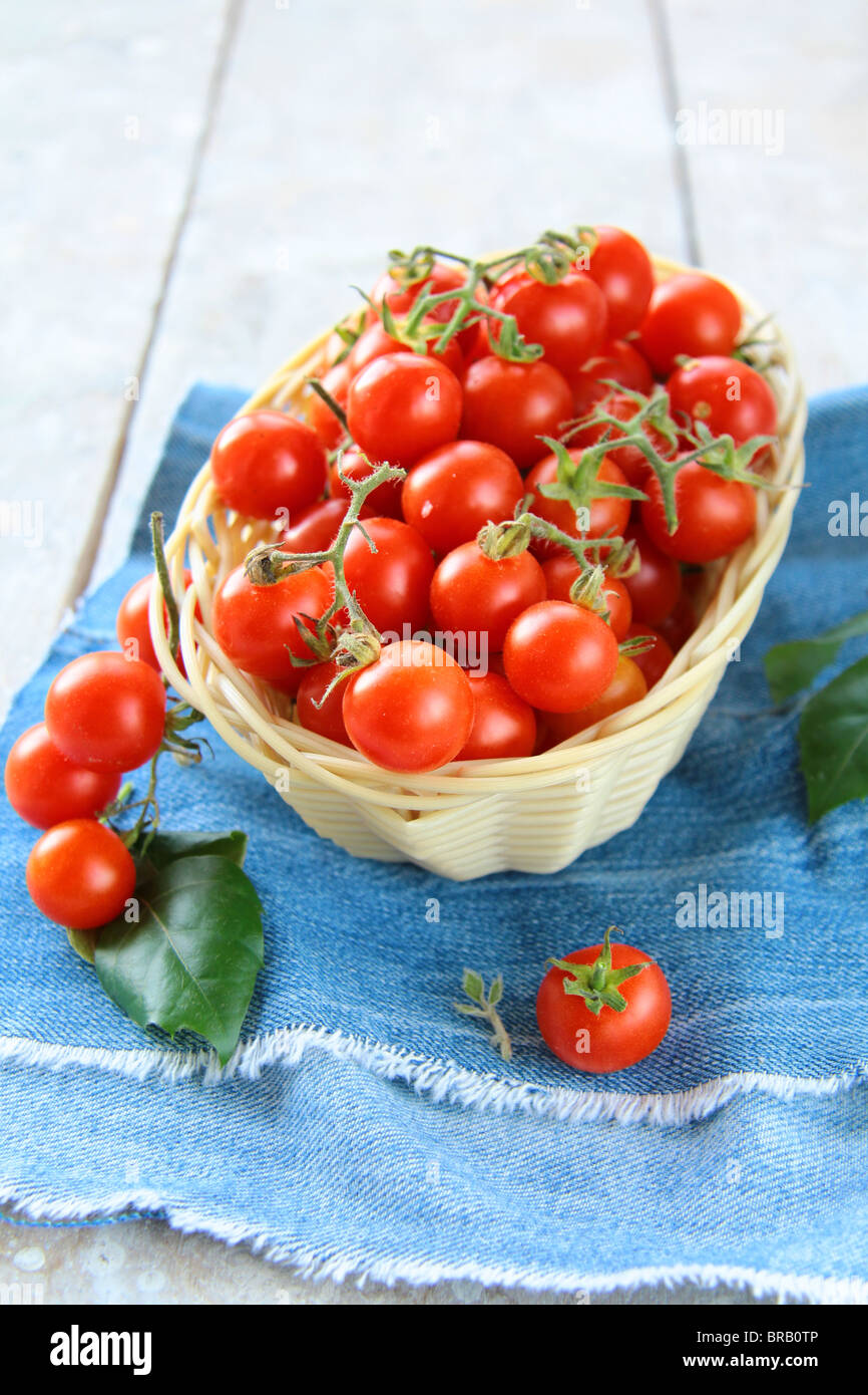 Cherry tomatoes in a wicker basket Stock Photo - Alamy