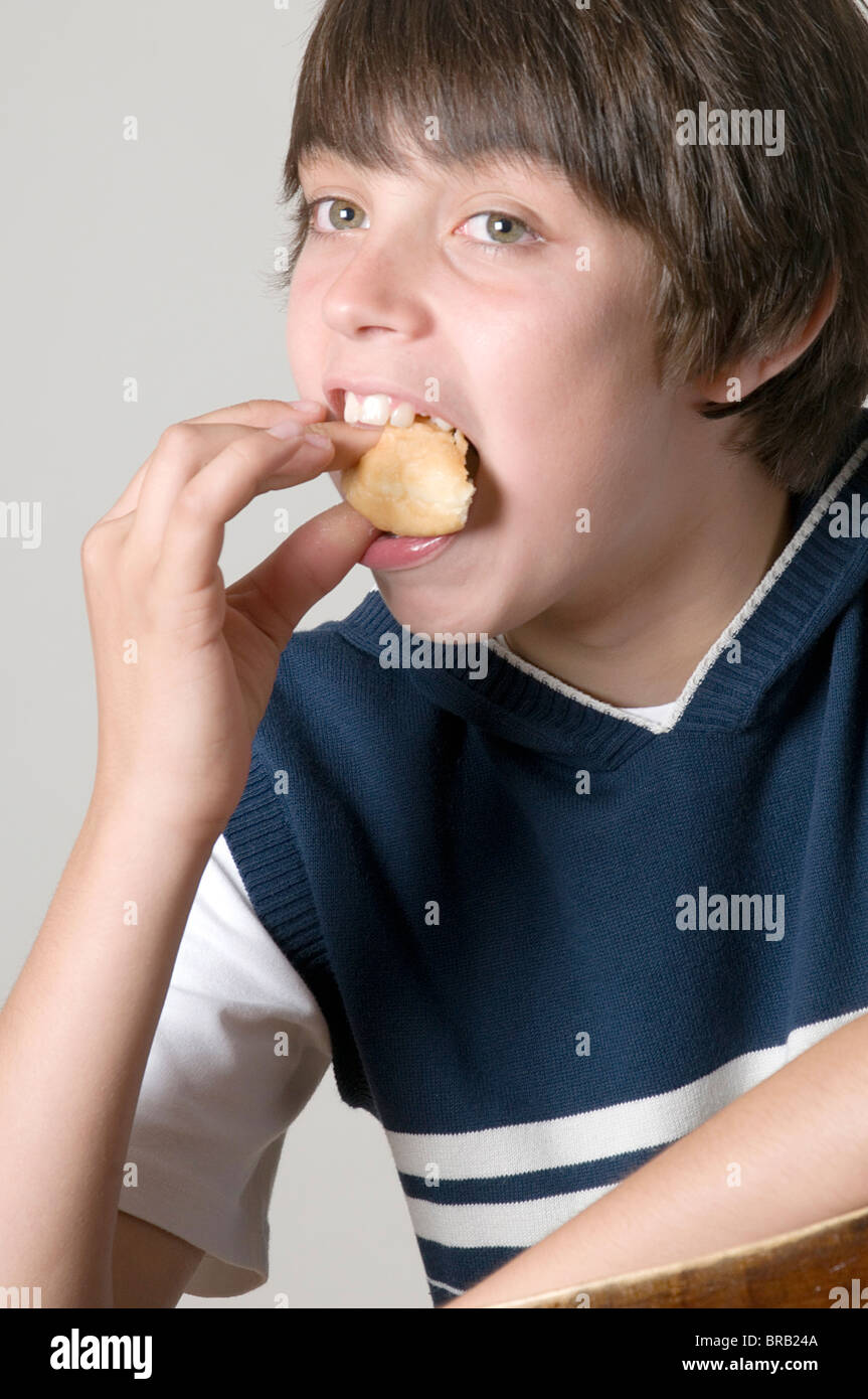 eat starving big huge diet junk food foods donuts ravenous sugar sugary growing weight gaining body stuffing face mouth teeth ch Stock Photo