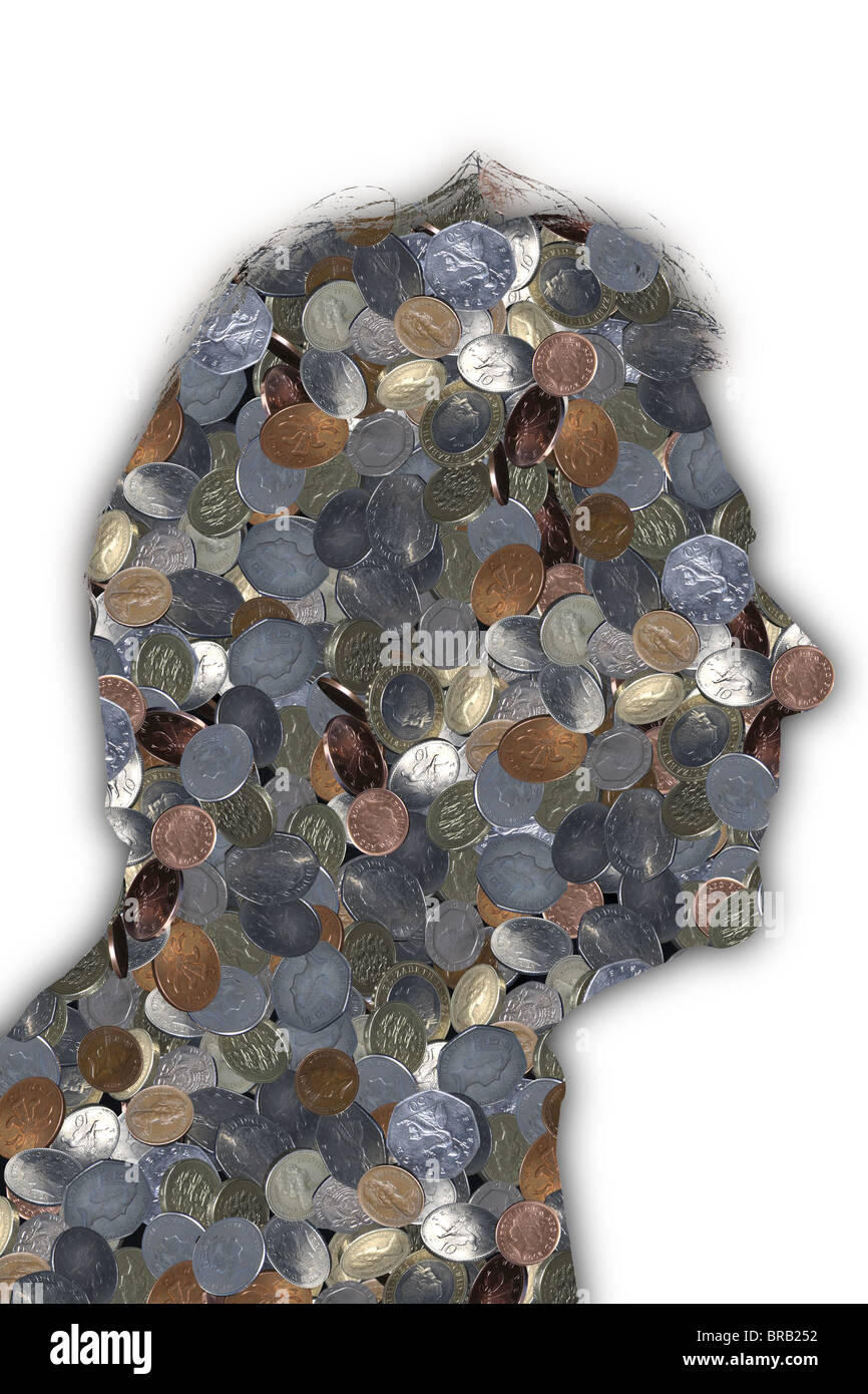 Outline of a mans head filled with British coins. Stock Photo