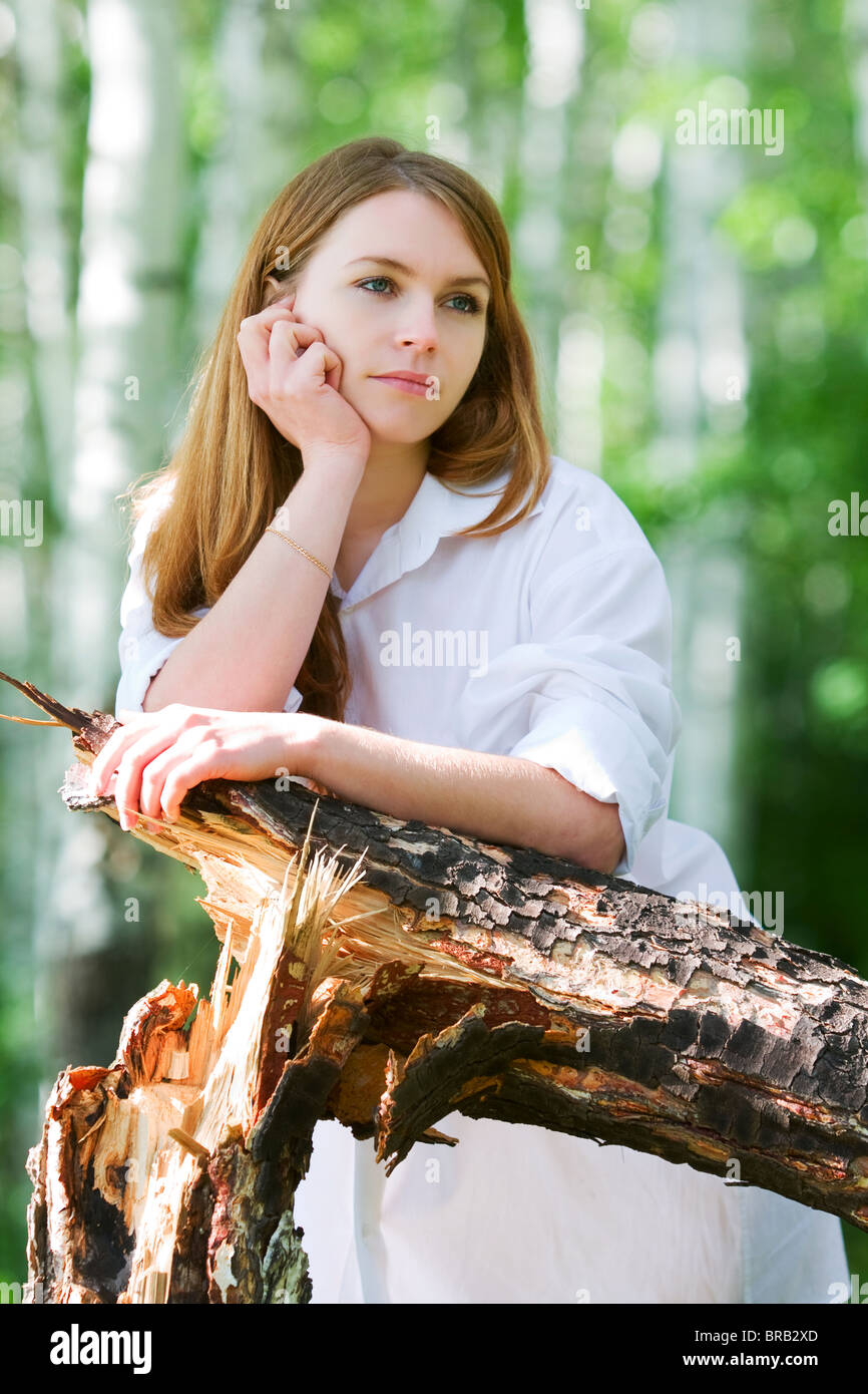 Young woman in the forest Stock Photo - Alamy
