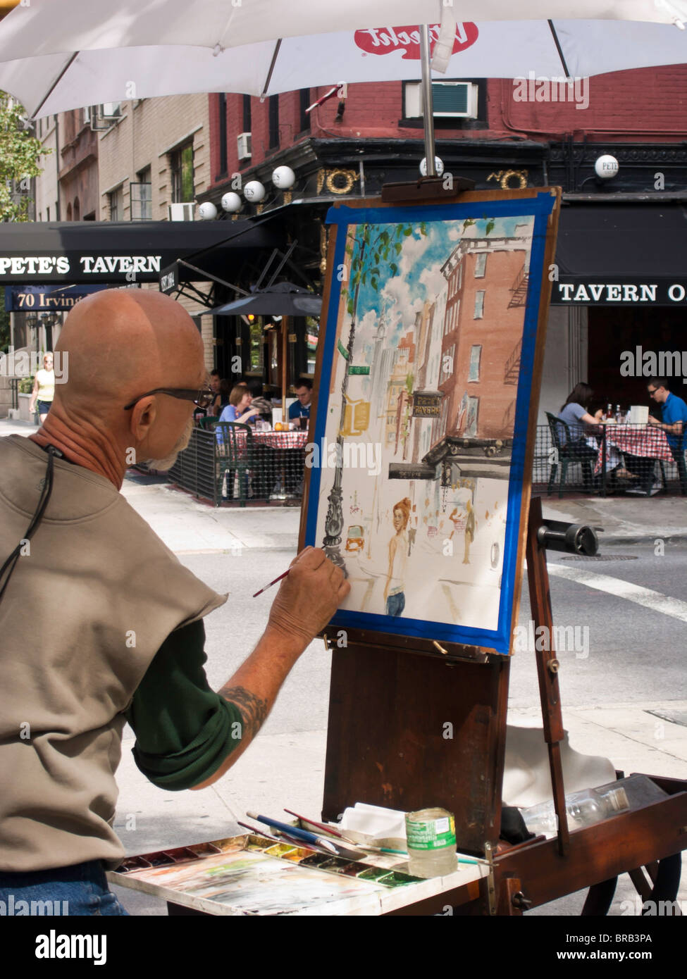 Artist Painting Pete's Tavern, Irving Place, NYC Stock Photo