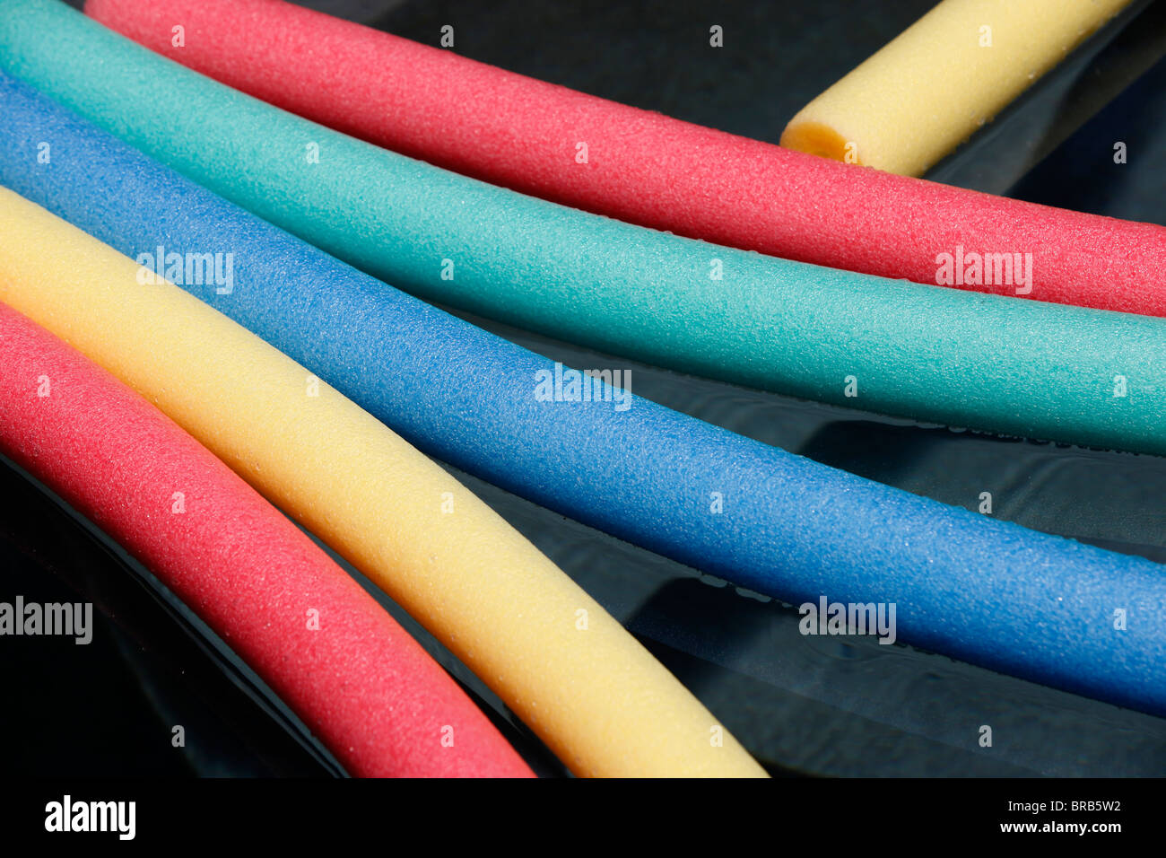 plastic floating tubes in a pool Stock Photo Alamy
