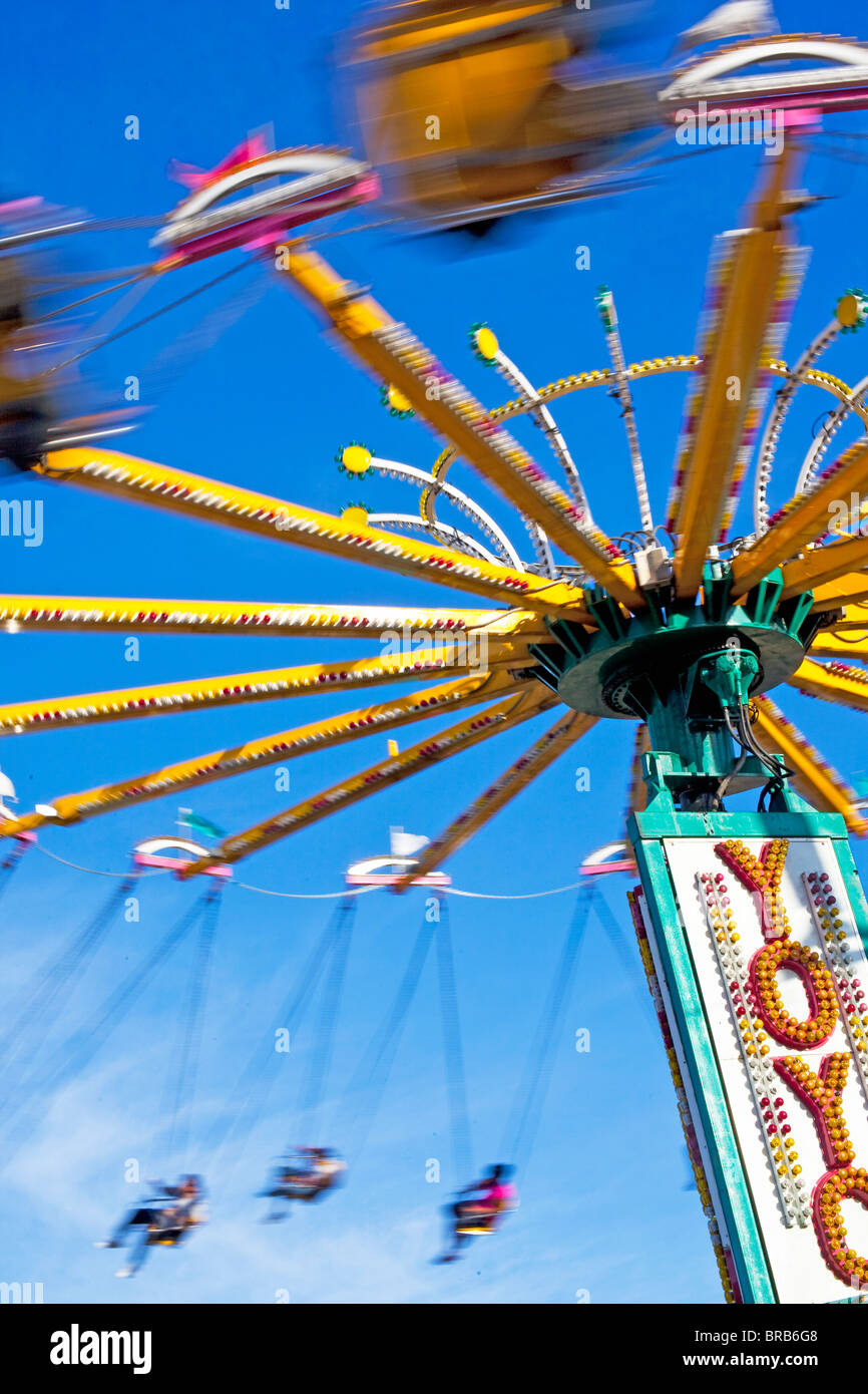 Swinging amusement park ride at the fair Stock Photo Alamy