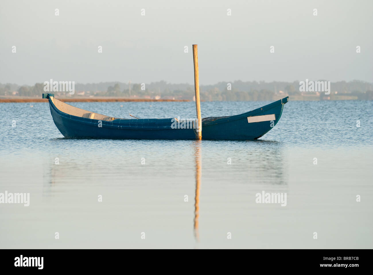 View of a traditional fishing boat anchored on water Stock Photo - Alamy