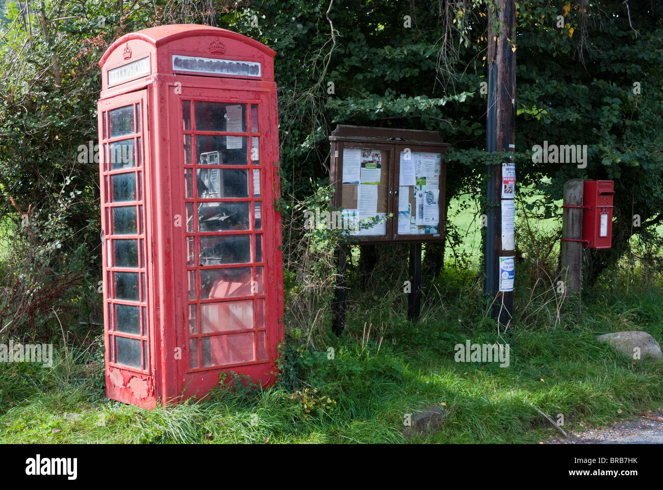 Abandoned traditional red Phone Box situated next to village ...