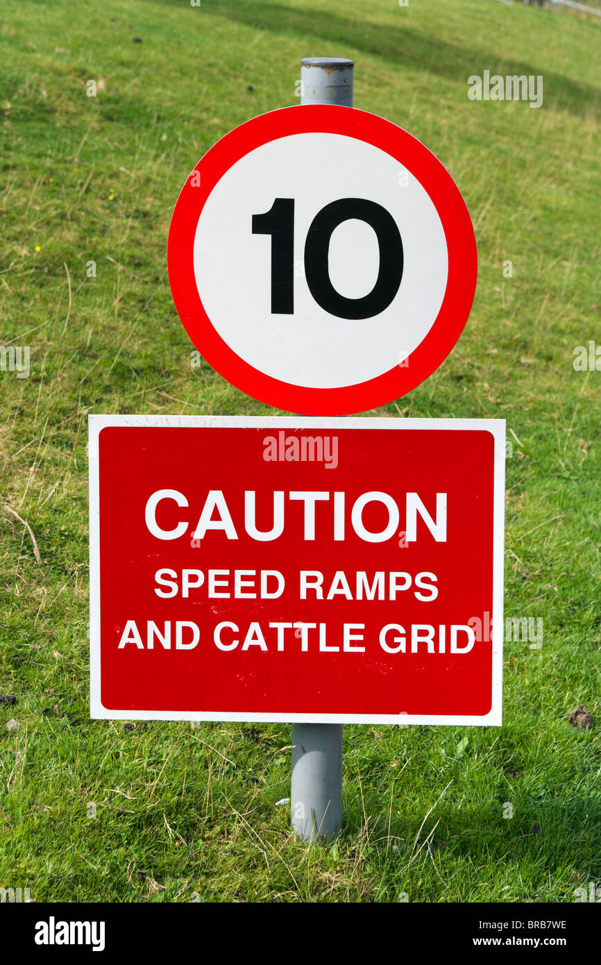 10 mph speed limit sign warning of ramps and cattle grid, West Yorkshire, England, UK Stock Photo