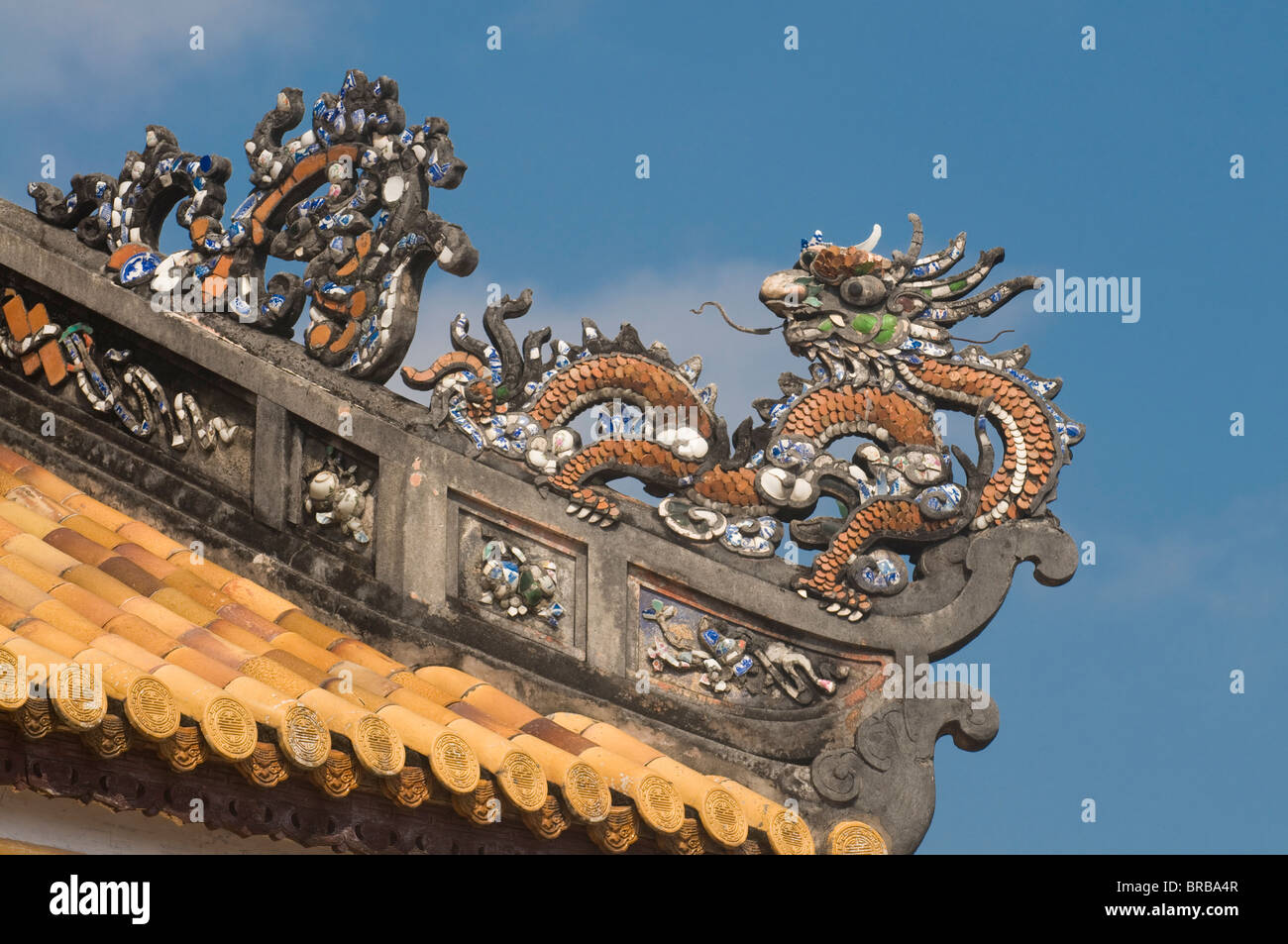 Dragons on top of the roof of the Halls of the Mandarins, Hue, Vietnam, Indochina, Southeast Asia, Asia Stock Photo