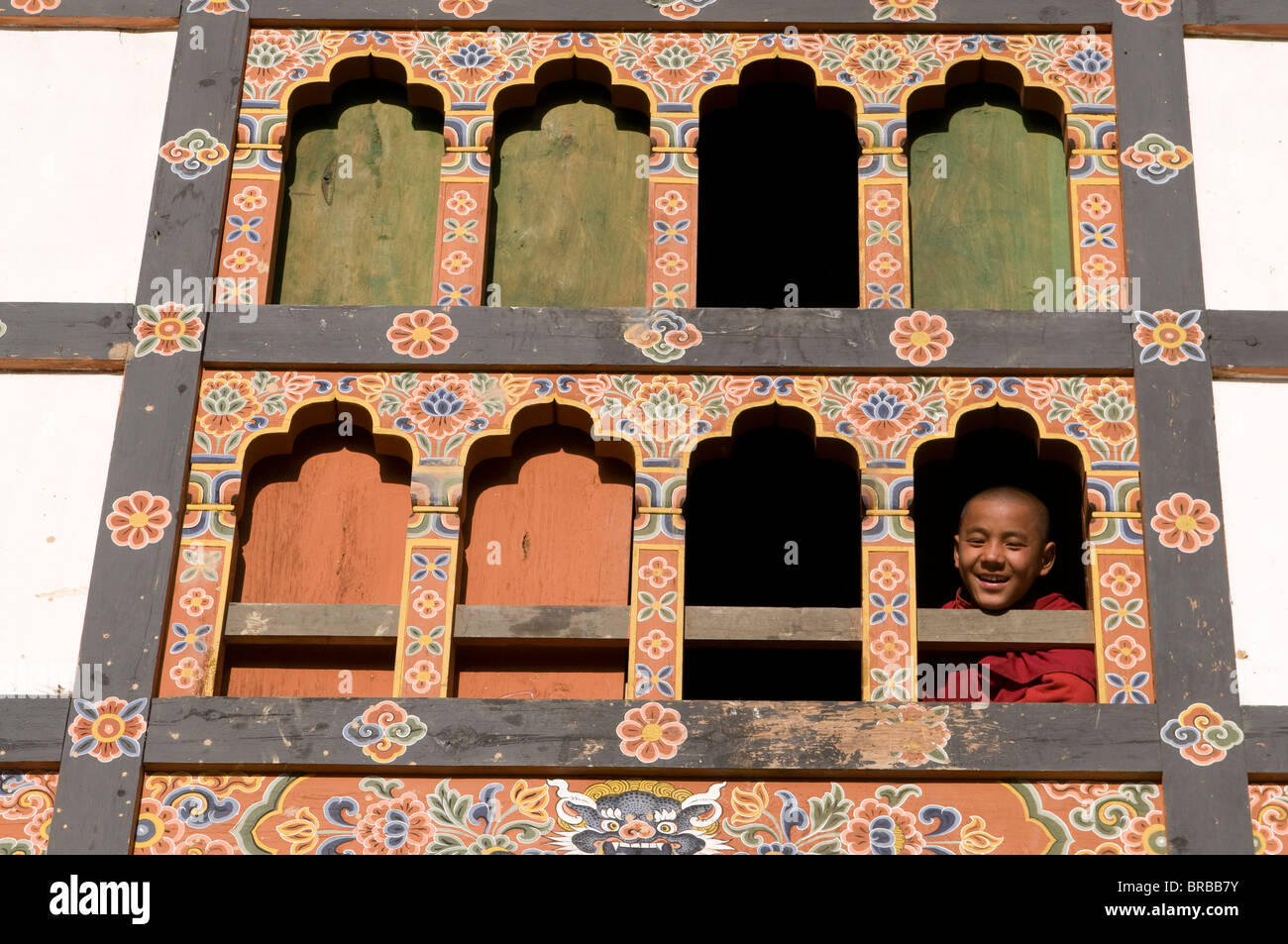 Young Buddhist monk at window, Gangte Goempa, Bhutan Stock Photo