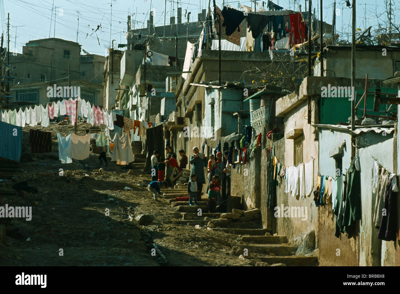 Jordan Middle East Amman Palestinian Refugee Camp. Women And Children  Outside Housing on hillside Hung With Washing Stock Photo - Alamy