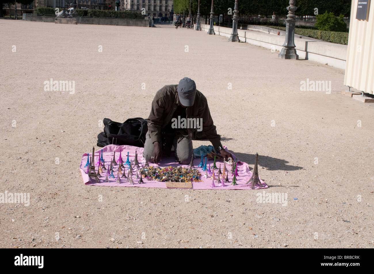 Man selling Eiffel Tower souvenirs, Jardin des Tuileries, Paris, France Stock Photo