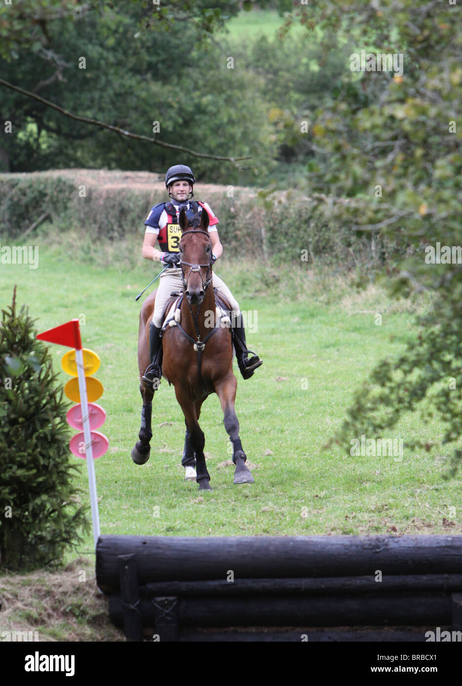 Horse and rider approaching a fence during the cross country phase of a