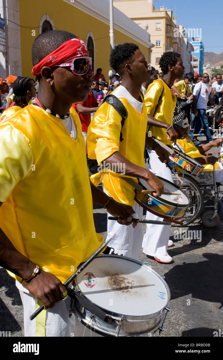 Costumed people celebrating Carnival while playing the drums, Mindelo, Sao Vicente, Cape Verde Stock Photo