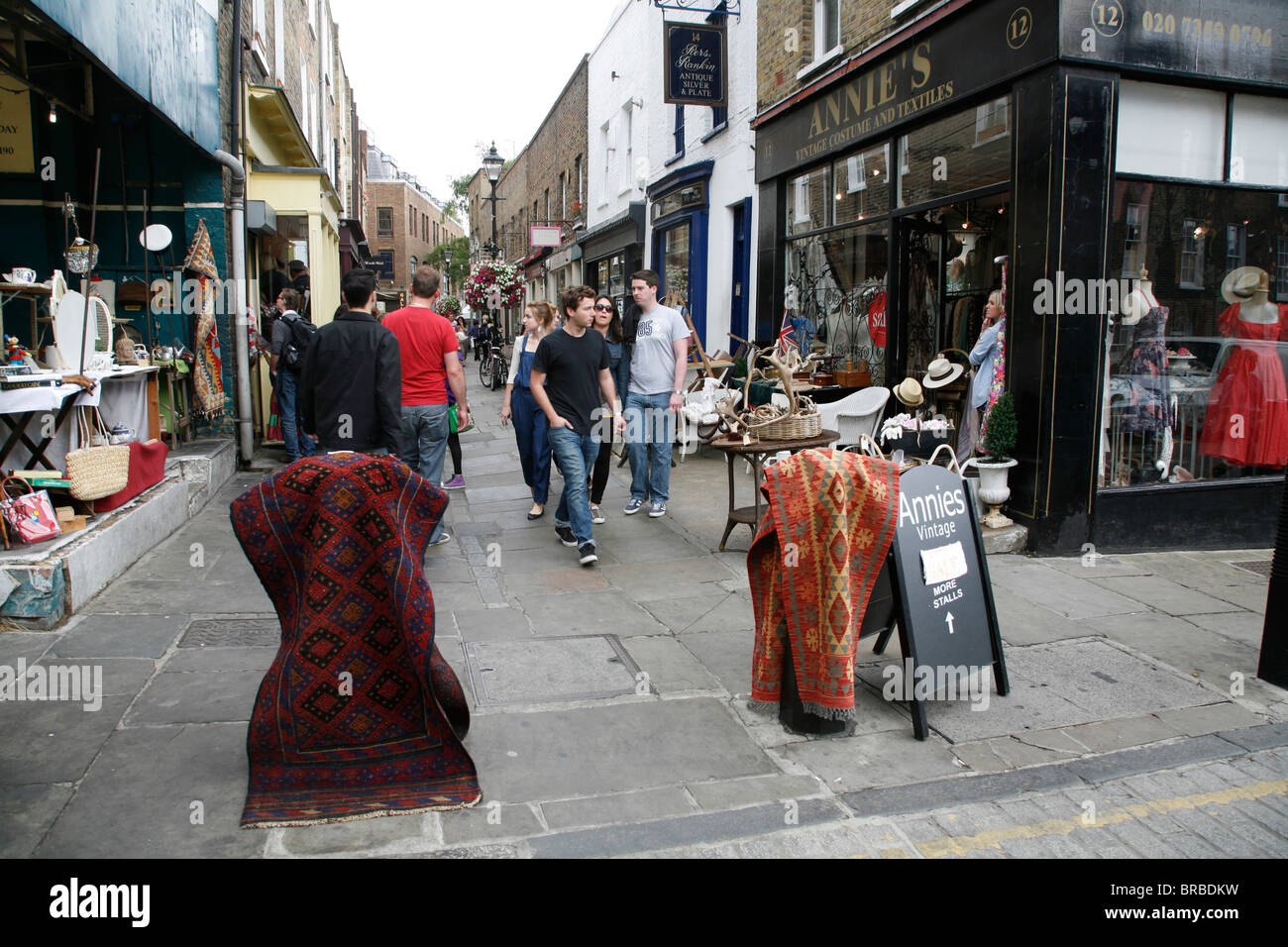 Rugs for sale at Camden Passage antiques market, Islington, London, UK