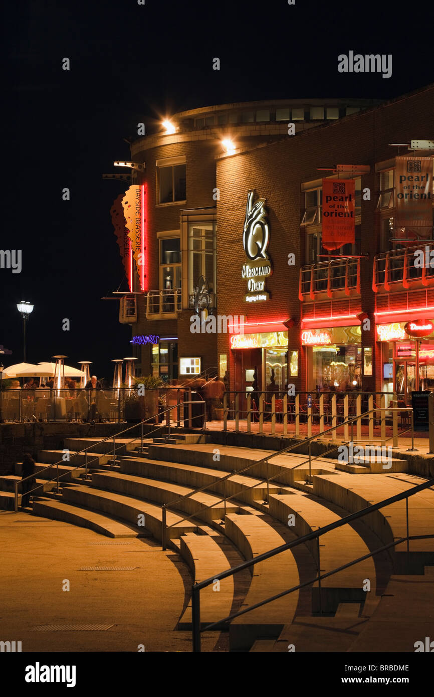 Restaurants on Mermaid Quay at night. Roald Dahl Plass, Cardiff Bay (Bae Caerdydd), Glamorgan, South Wales, UK, Britain Stock Photo