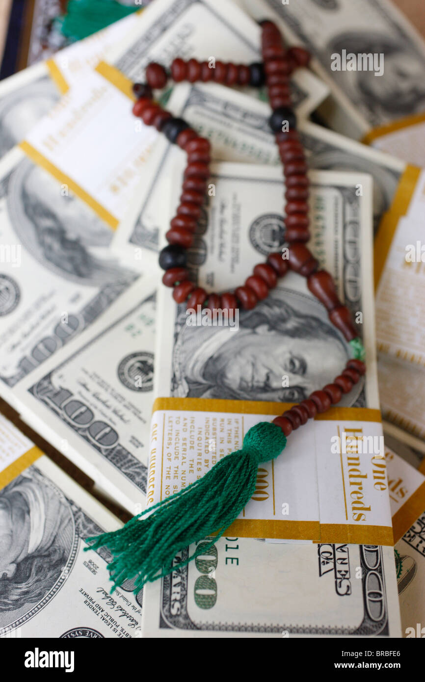 Muslim prayer beads and bank notes, France Stock Photo