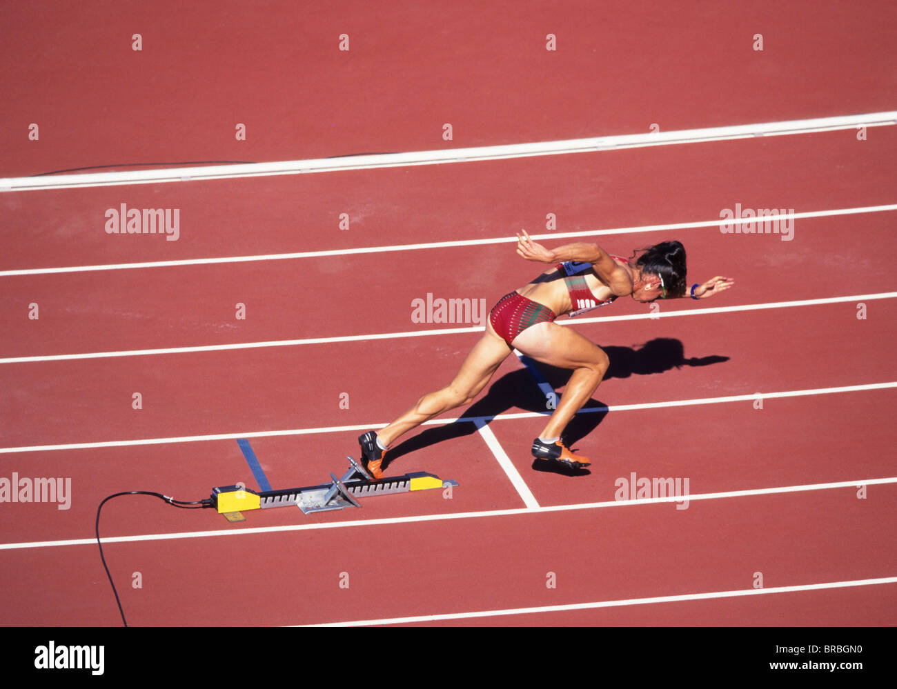 Measuring The Running Speed Of An Athlete Using A Mechanical Stopwatch Hand  With A Stopwatch On The Background Of The Legs Of A Runner Stock Photo -  Download Image Now - iStock