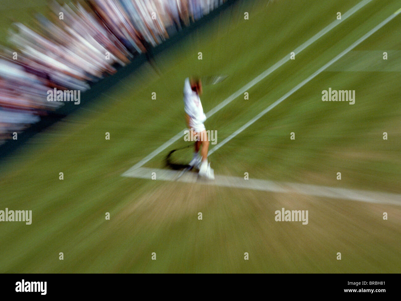 Blur action view of male tennis player returning serve Stock Photo