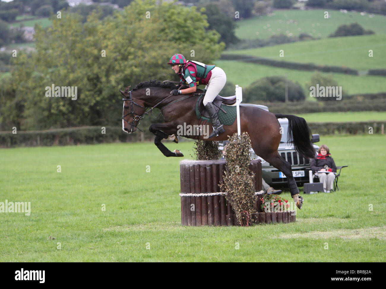 Horse and rider jumping a fence during the cross country phase of a one