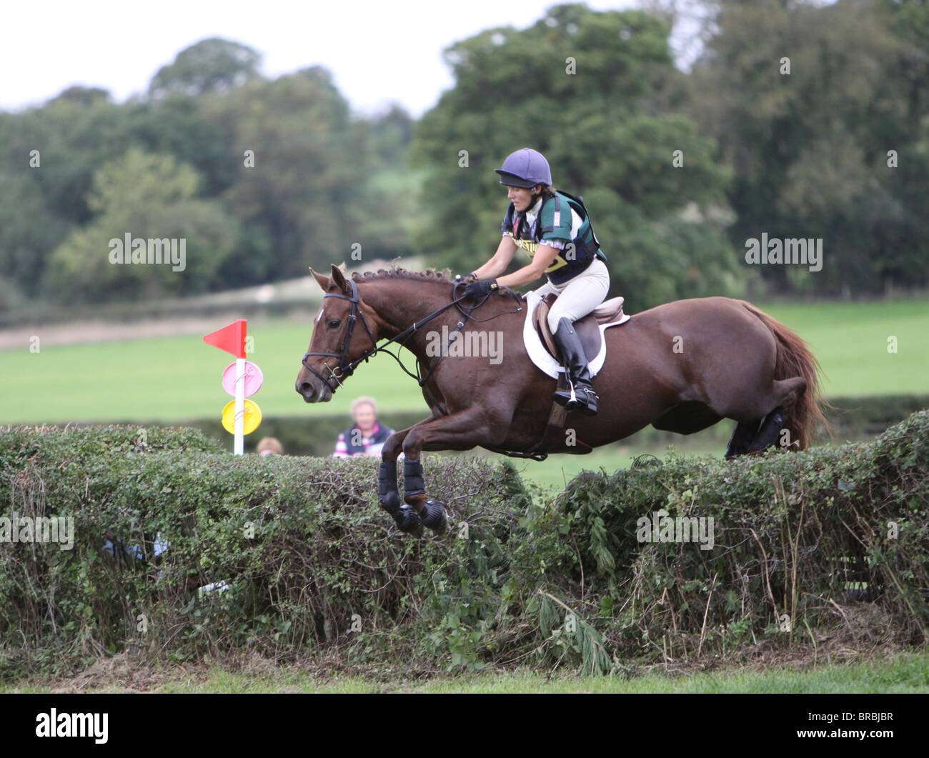 Horse and rider jumping a fence during the cross country phase of a one