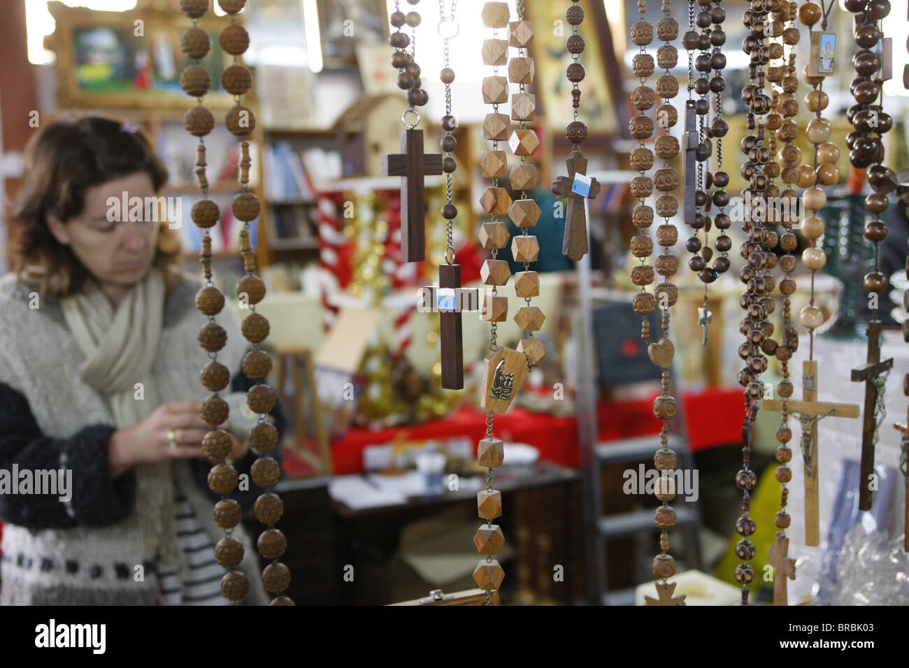 Religious objects sold at a flea market, Cluses, Haute Savoie, France Stock Photo