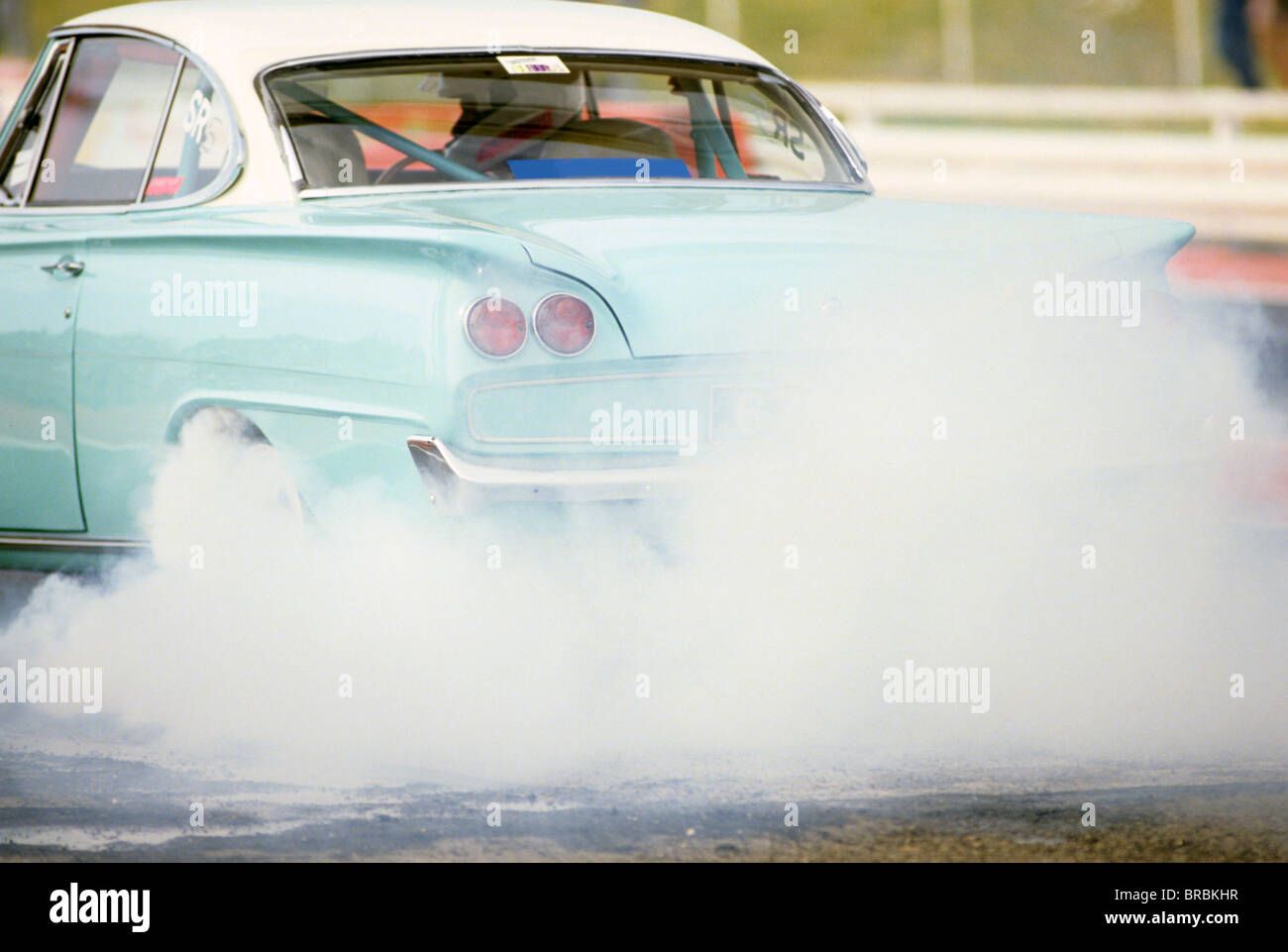 Funny car spinning wheels to lay down rubber Stock Photo Alamy