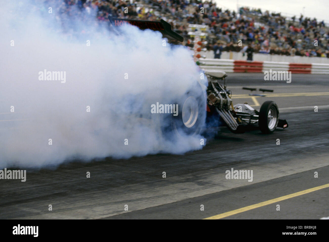 Top Fuel Car leaving starting line at a drag race Stock Photo