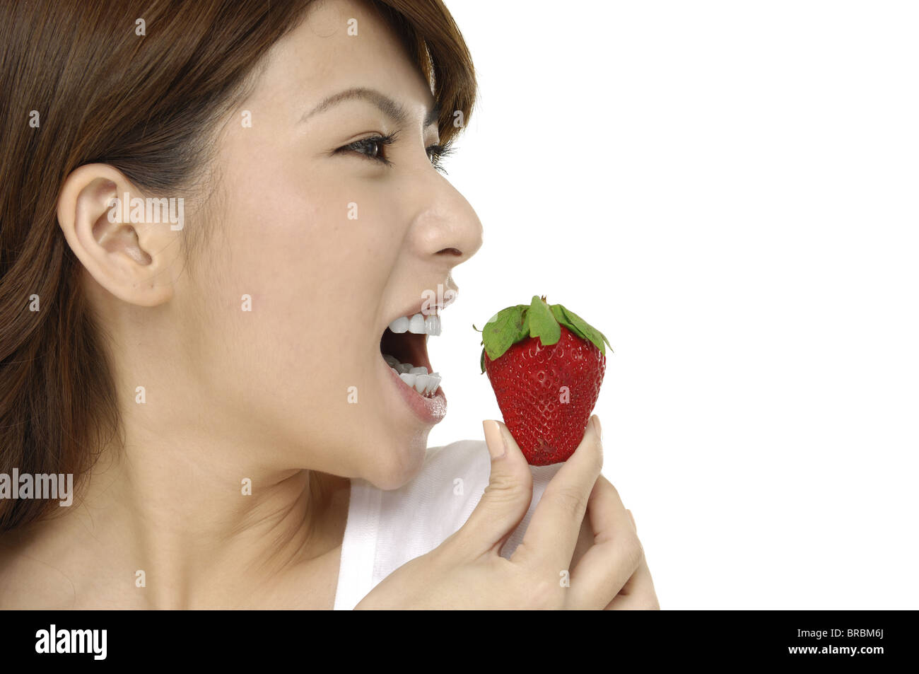 portrait of a beautiful Asian woman with strawberry Stock Photo