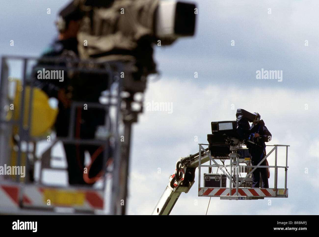Camera cres on gantries at a sports event Stock Photo