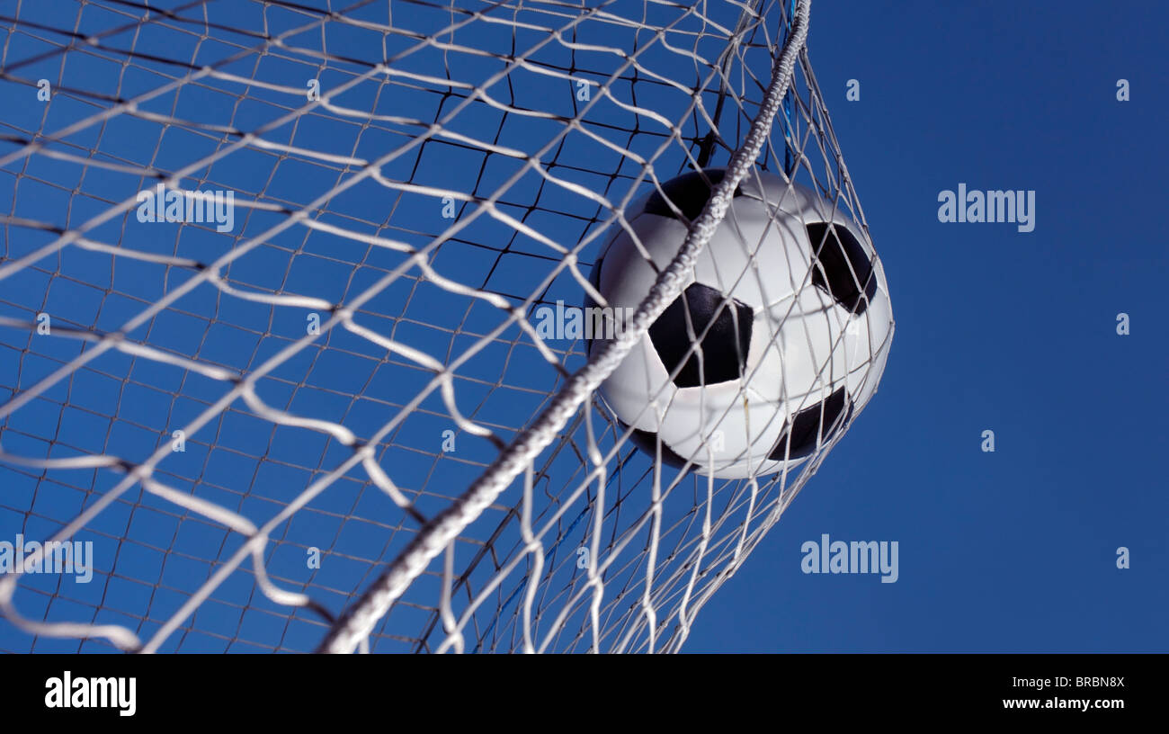 Soccer Ball Kicked Into A Goal Stock Photo Alamy