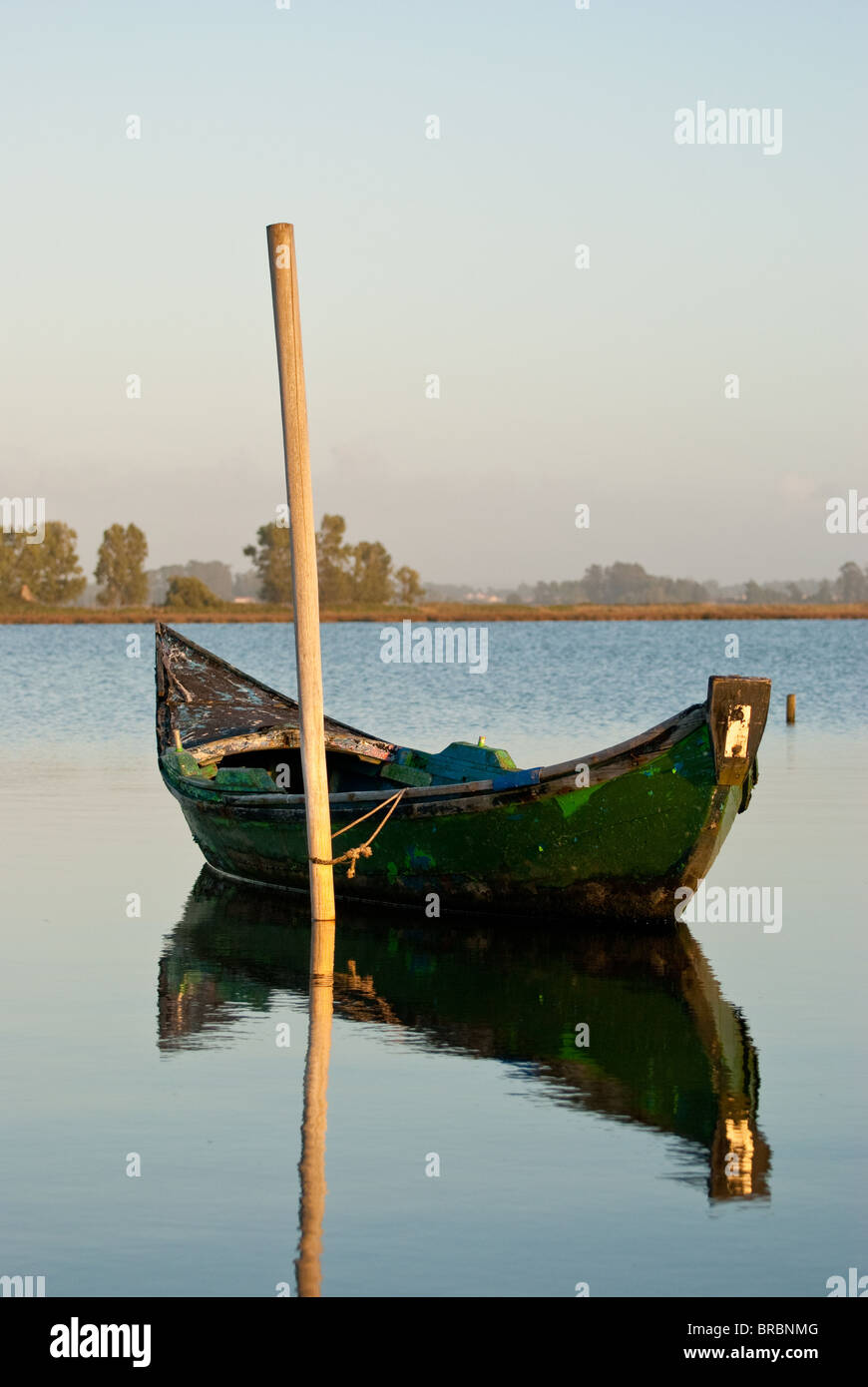 View of a traditional fishing boat anchored on water Stock Photo - Alamy