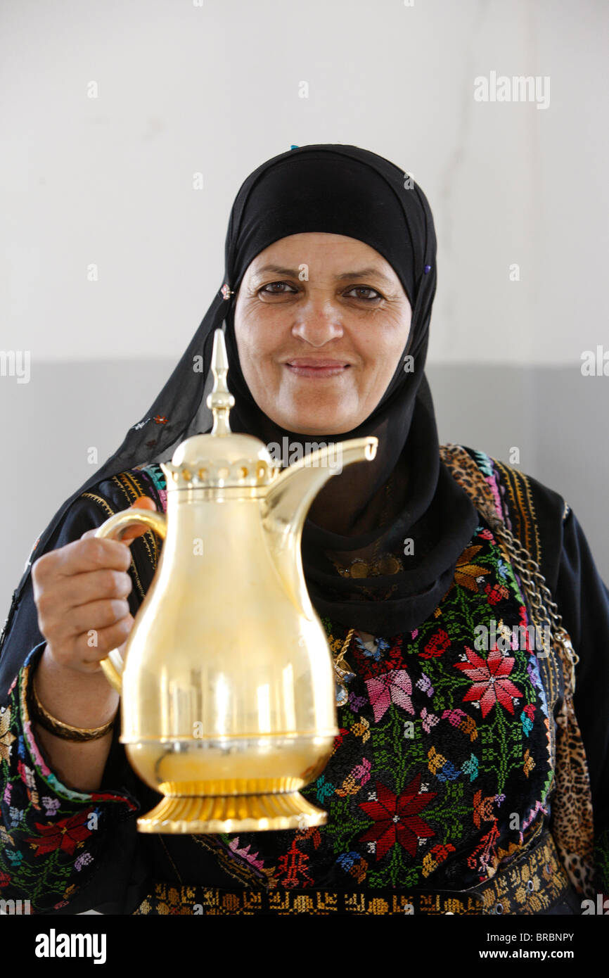 Palestinian volunteer offering coffee at the Physicians for Human