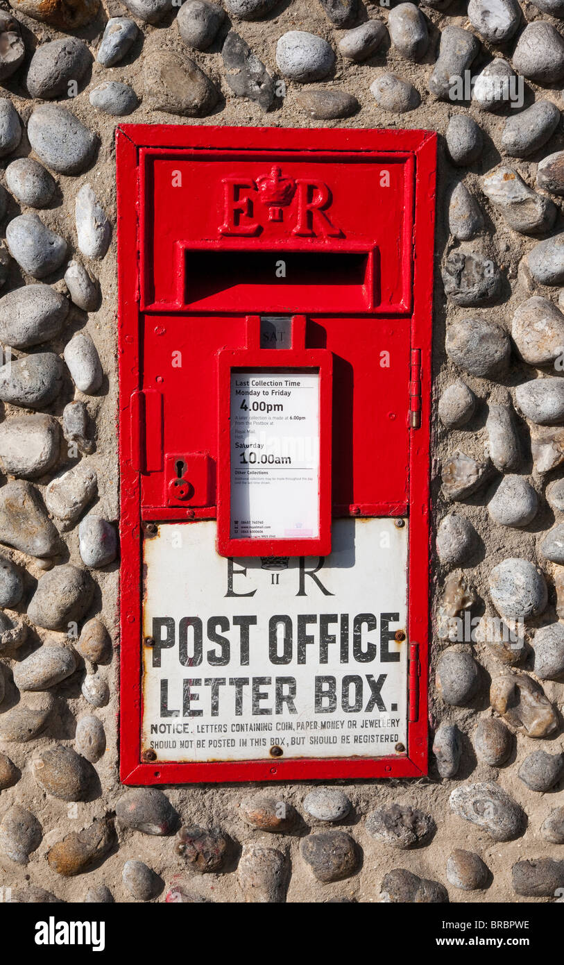 Letter box mounted in a pebble dash wall Stock Photo