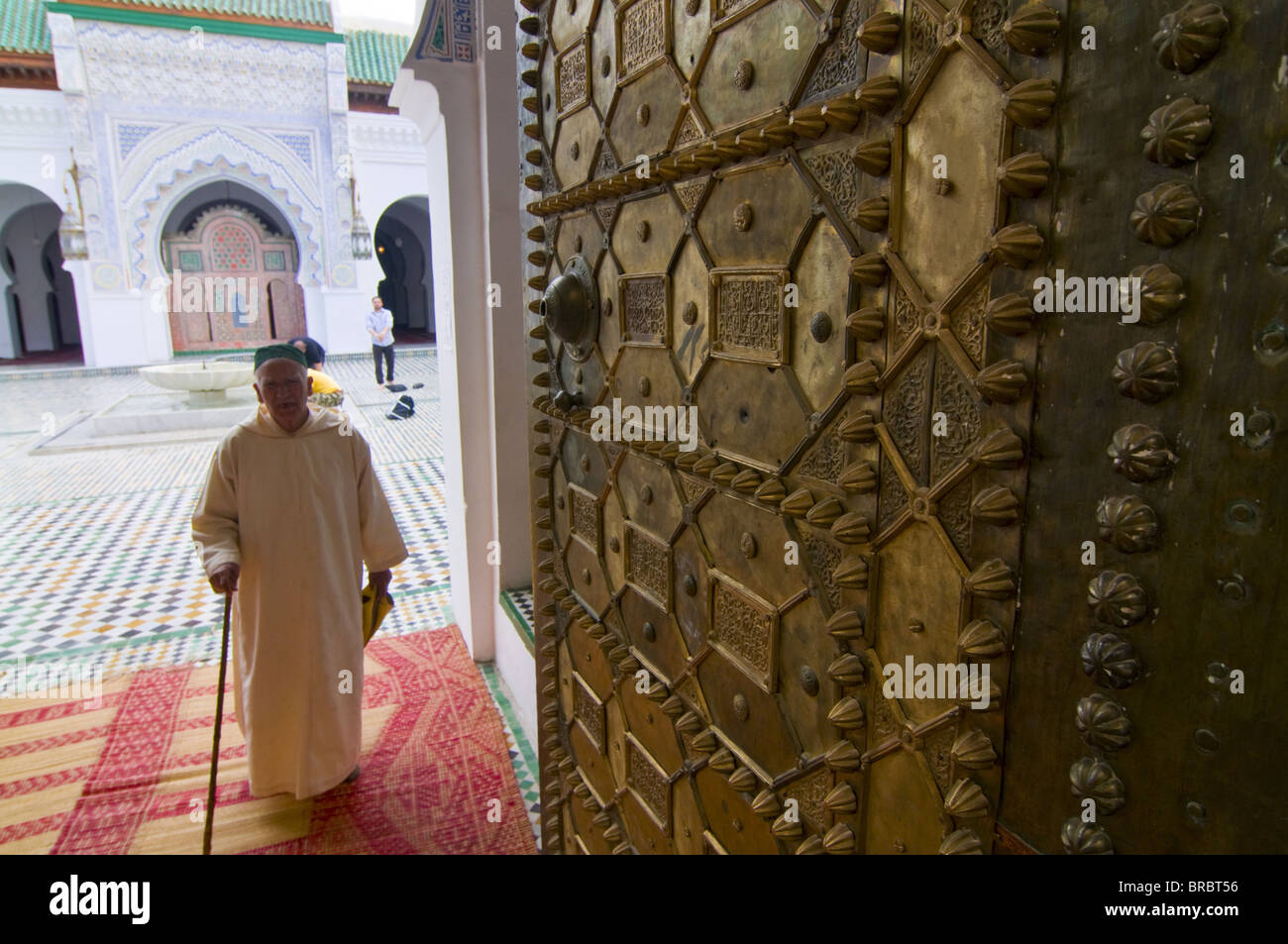 Old man leaving a mosque in the old Medina, UNESCO World Heritage Site, Fez, Morocco, North Africa Stock Photo