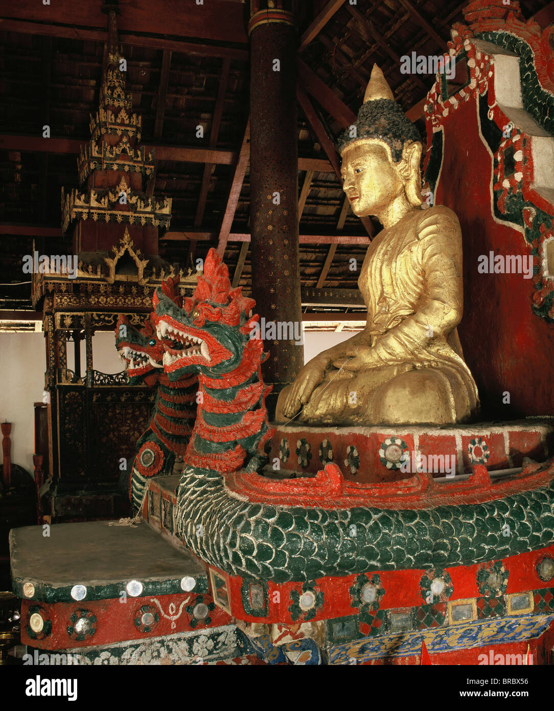 Wat Nong Deng, a classic Thai Lu temple, with Buddha sitting on Naga throne, Province of Nan, Northern Thailand, Thailand Stock Photo