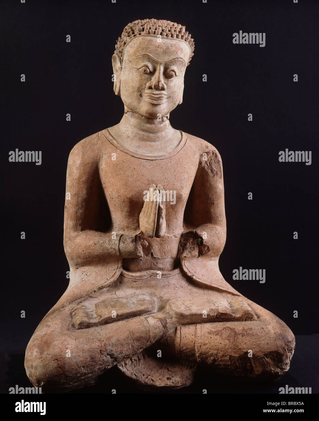 Terracotta Disciple of Buddha, 12th century Haripunchai style, Haripunchai National Museum, Lamphun, Thailand Stock Photo