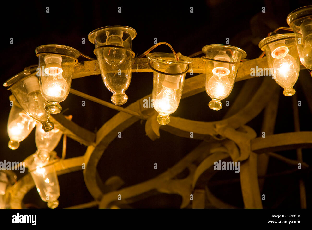 Close up of rustic traditional wooden chandelier with light bulbs in Istanbul Aya Sofya mosque Stock Photo