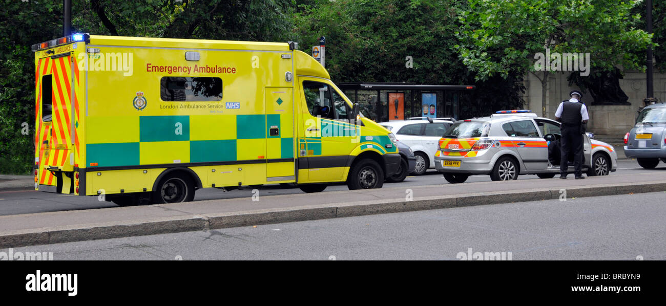 Ambulance and Police car attending road traffic accident Stock Photo