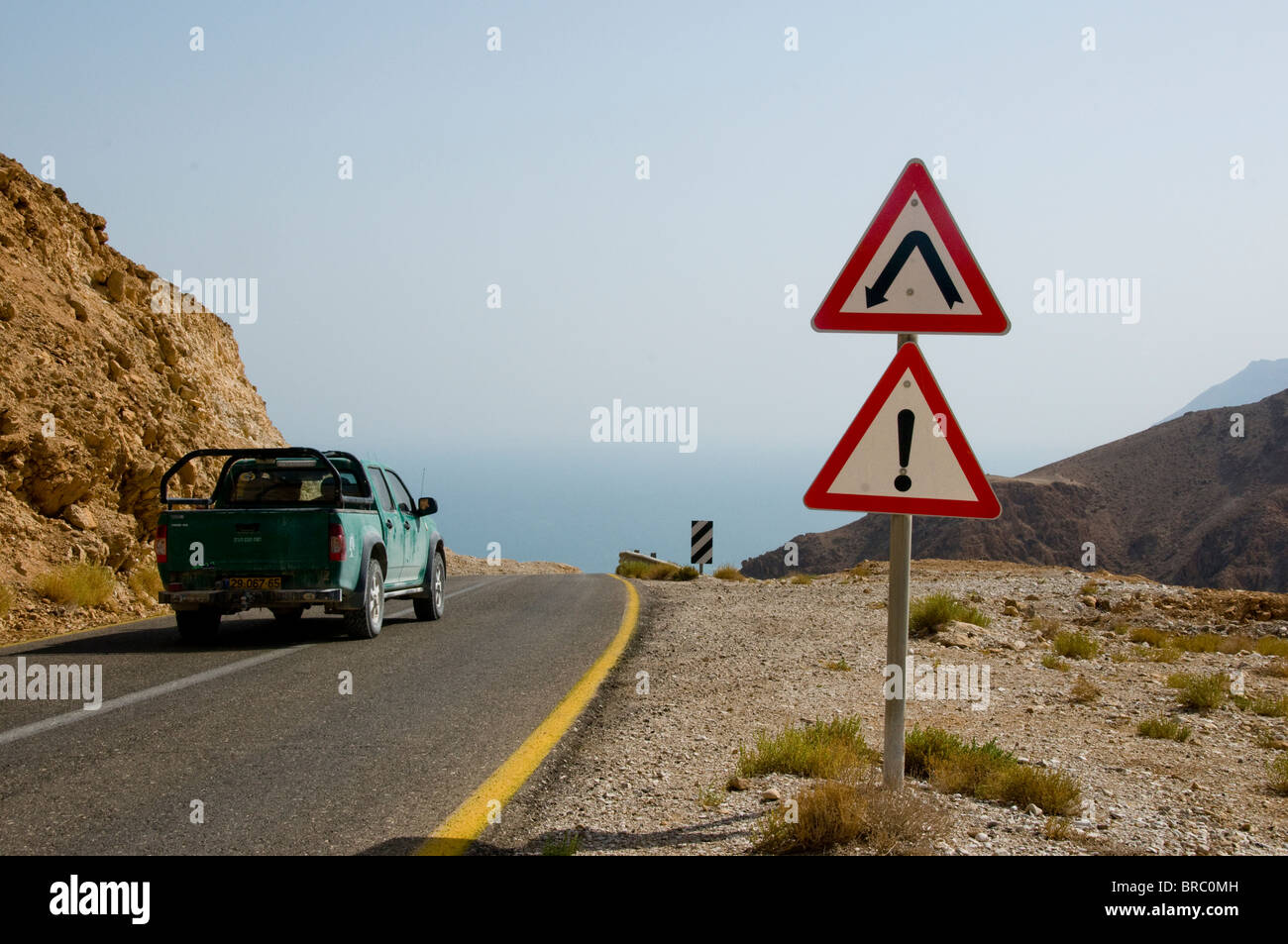 Road Signs For A Very Sharp Left Bend On Mountain Road Near Metzoke Stock Photo Alamy