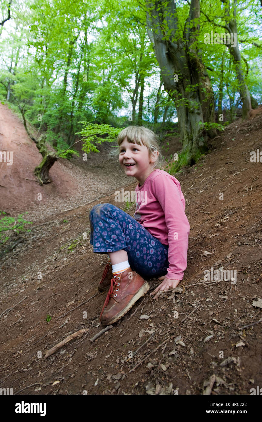 A girl romping in the forest Stock Photo